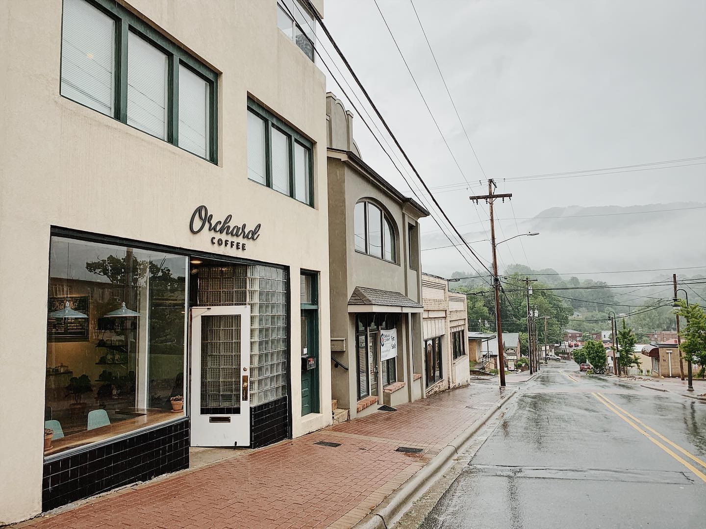 Orchard Coffee in Downtown Waynesville, NC Exterior photo of Orchard Coffee in Downtown Waynesville, NC on a rainy day.